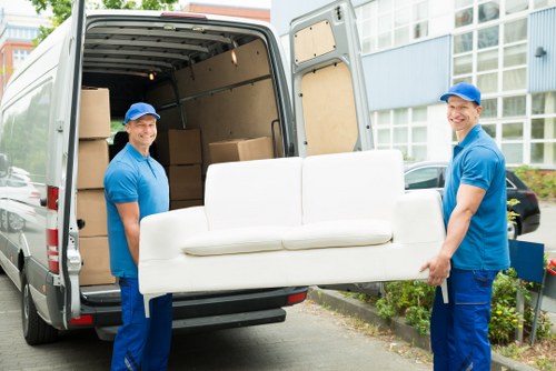 Movers in Shoreditch planning a local home move on a busy East London street