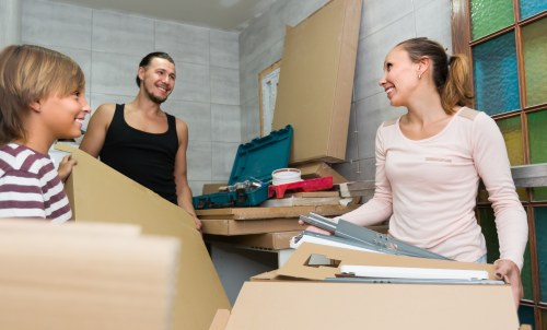 House removalists loading boxes in Shoreditch street