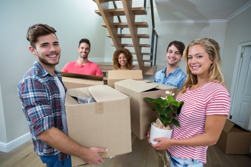 Professional movers handling office furniture during a Shoreditch relocation