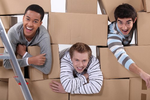 Removal team safely handling boxes during a move