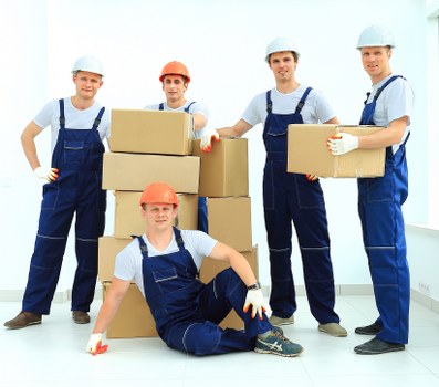 Local movers unpacking boxes in a Shoreditch apartment