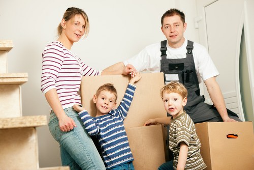 Specialist movers preparing a piano for transport in Shoreditch