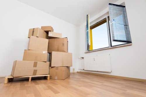Local removal van navigating a busy Shoreditch street for a same day move