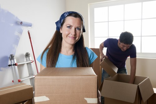 House removalists working on a Shoreditch home move with boxes and furniture