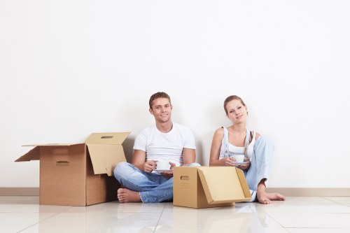 Careful packing of fragile household items by a Shoreditch moving service