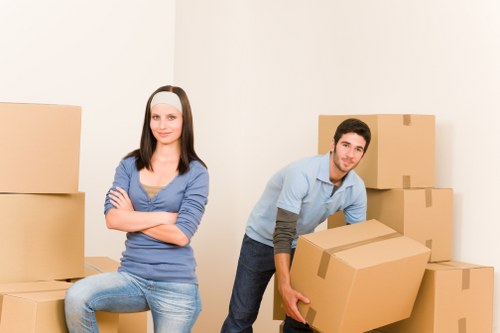 Packed moving boxes and furniture ready for transport in Shoreditch