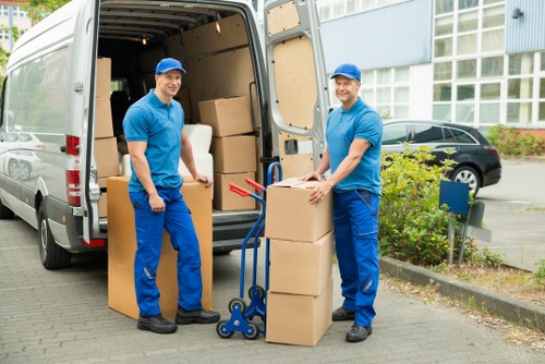 Packed boxes and furniture ready for transport by a Shoreditch van service
