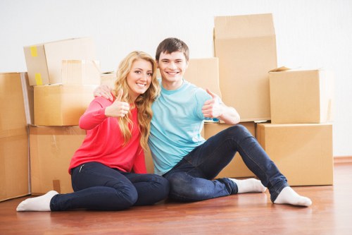 Staff assessing risks before lifting furniture