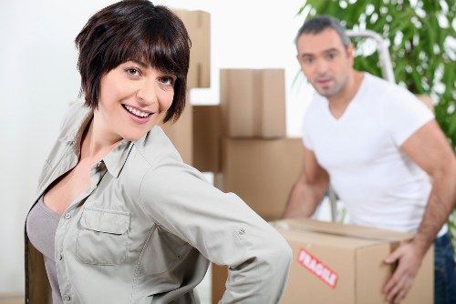 Professional movers handling furniture in a Shoreditch property