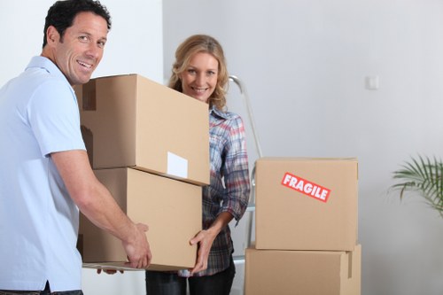 Moving boxes and wrapped items during a Shoreditch relocation