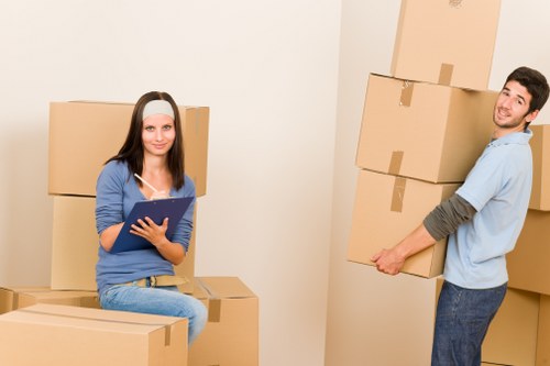 Professional team loading old furniture for pick-up